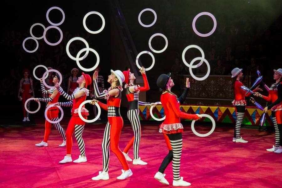 It looks like every piece of circus props available is airborne at once!