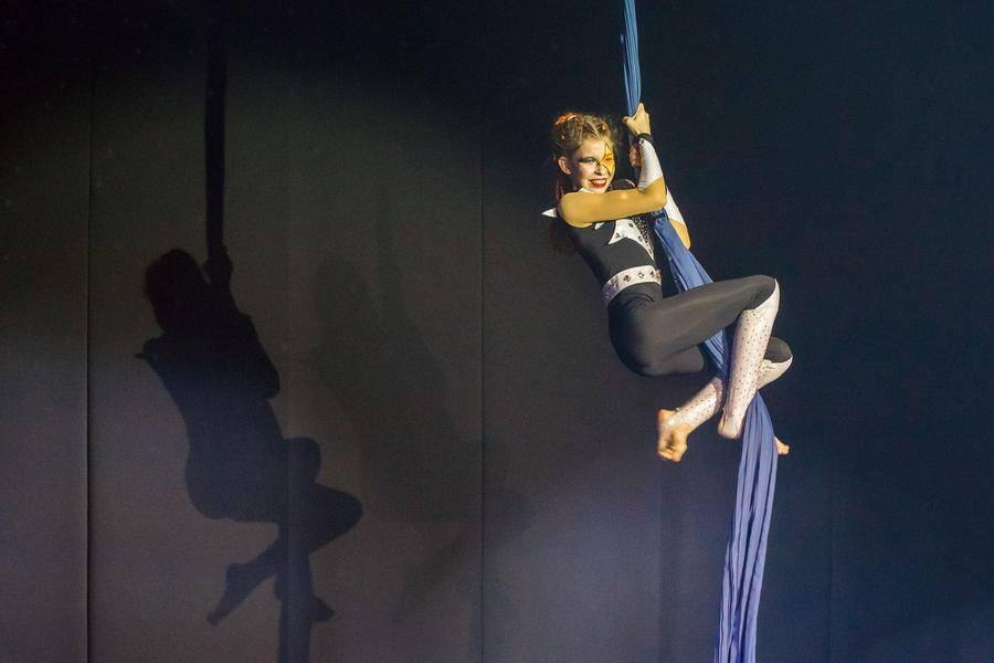 Aerial silks let her show off her skills — especially when she climbs higher